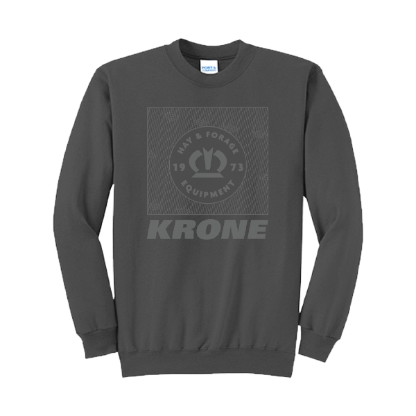 Charcoal long-sleeve crewneck sweatshirt with a large tonal graphic on the chest showcasing the Krone crown, “Hay & Forage Equipment,” and “1973” in a bold square layout