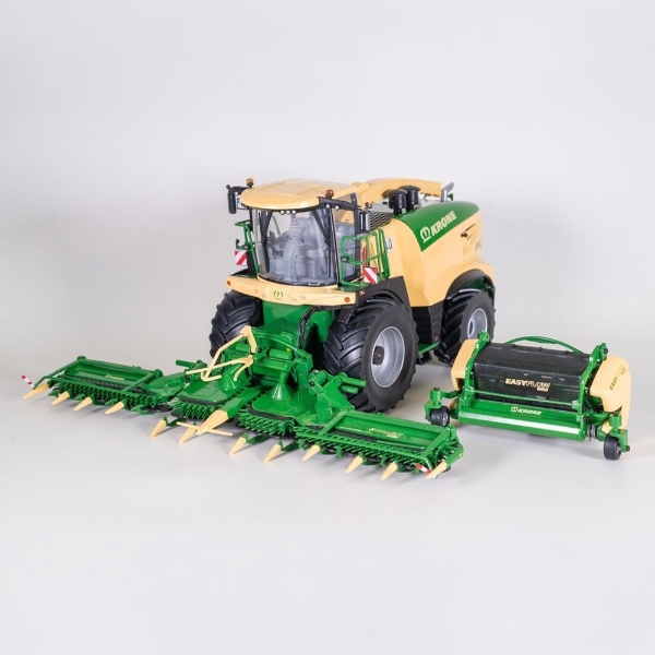 1:32 Scale model forage harvester with green and yellow design and attached maize header on gray background