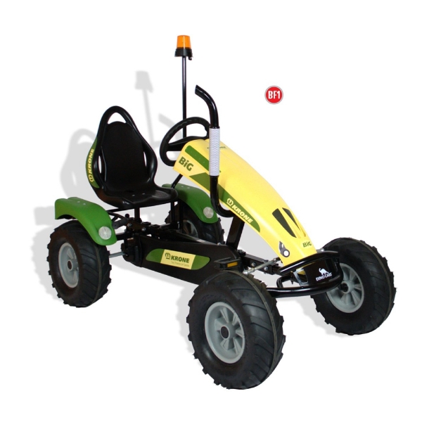 Green and yellow pedal kart with large treaded wheels on white background