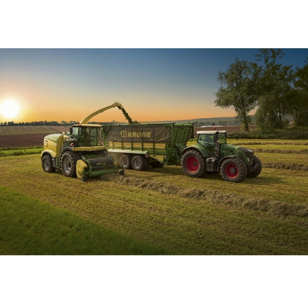 Poster featuring farm equipment working in a field at sunset