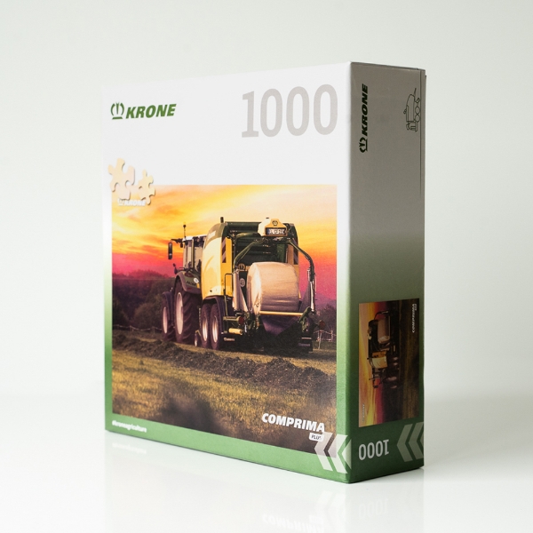 1000‑piece puzzle box featuring a round baler working at sunset