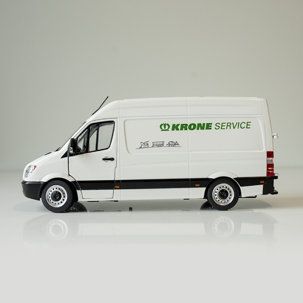 White service truck model with green farm‑themed lettering shown from side view