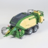 Detailed square baler model in green and cream colors on white background