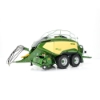 Side view of large square baler model showing twin axles, curved body panels, pickup assembly, and front hitch detail