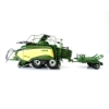 Side view of large square baler model connected to BaleCollect trailer showing twin axles, pickup assembly, and extended bale collector