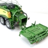 Close‑up of bale chamber and BaleCollect trailer connection showing hitch detail and folding platform sections