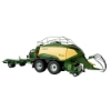 Side profile of large square baler model connected to BaleCollect trailer showing twin axles, curved body panels, pickup assembly, and extended collection unit